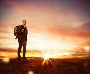 Businessman with explorer backpack looking for new business