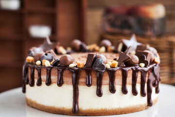 Delicious two-ply chocolate cheesecake decorated with candies and frosting