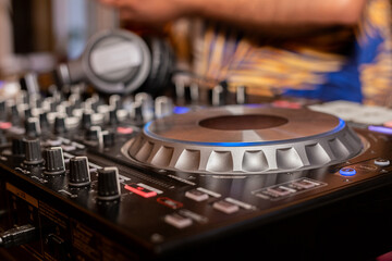 Headphones on dj console deck Big dj headphones to mix music at night club party Professional...