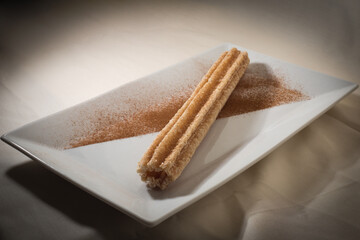 Cinnamon churro on a plate