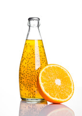 Bottle of exotic healthy juice with orange on white background