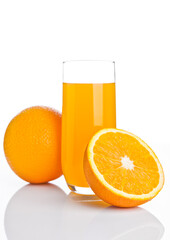 Glass of healthy orange juice with fruit on white background