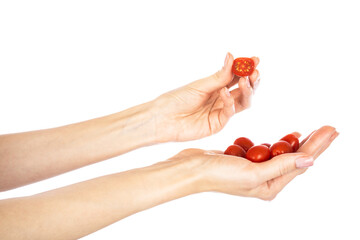 Cherry tomato in woman hand isolated on white background