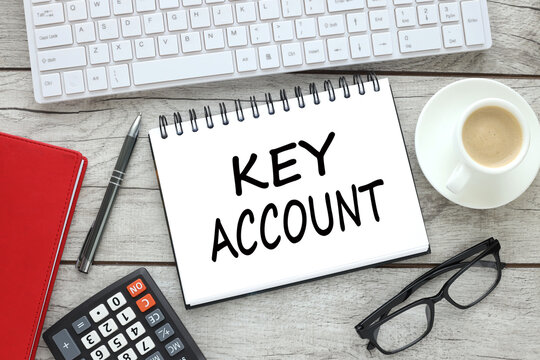 notepad on work desk near white keyboard text KEY ACCOUNT MANAGEMENT