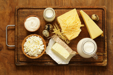 Fototapeta na wymiar Assorted dairy products (milk, yogurt, cottage cheese, sour cream) rustic still life