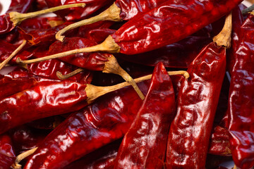 Bright Red dried red chillies are display on white background