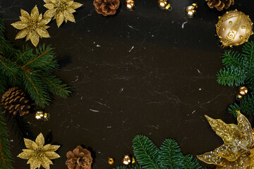 Christmas flat lay styled scene - frame with golden decorations on black background