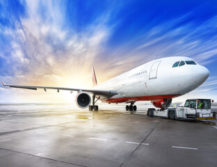 Fototapeta na wymiar airliner on a runway against a sunset