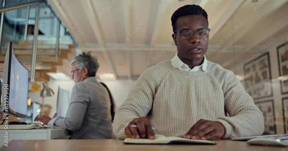 Poster writing, notebook and research with a business black man at his desk in the office for planning a st
