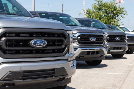 Ford F-150 display at a dealership. The Ford F150 is available in XL, XLT, Lariat, King Ranch, Platinum, and Limited models.