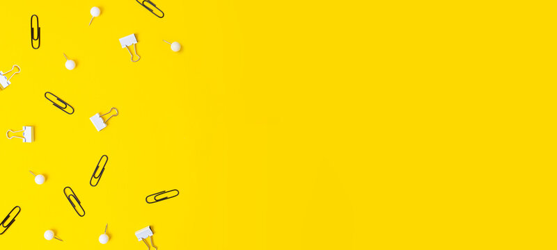 Black and white stationery on yellow background, negative space.Back to school concept. - Powered by Adobe