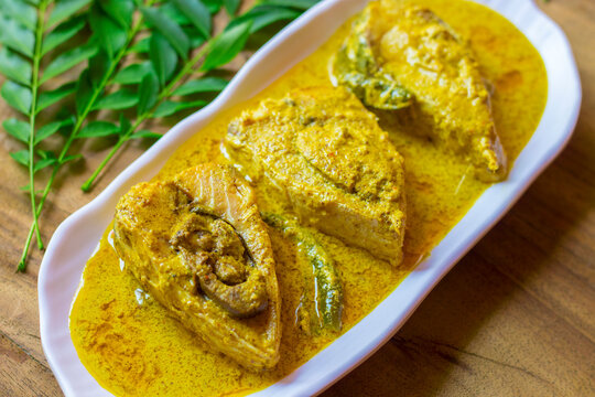 selective focus of Illish or Hilsa fish cooking with mustard seed.famous in India and Bangladesh. 