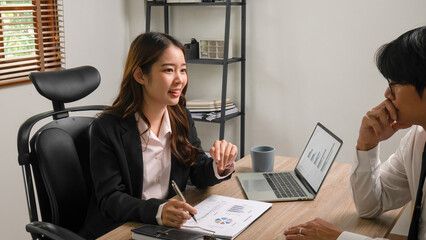 Businessmen working and discussing together.