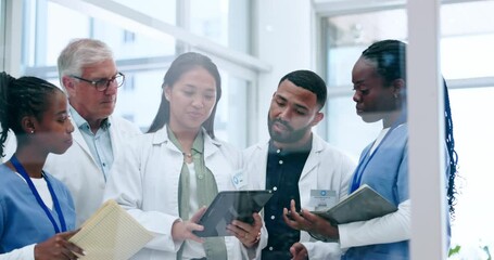 Tablet, healthcare and team of doctors meeting in the hospital for diagnosis or treatment discussion. Teamwork, technology and planning with a medicine professional talking to colleagues in a clinic - Powered by Adobe