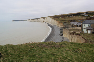 Fototapeta na wymiar A Winter walk in East Sussex to see the Seven Sisters, Cuckmere Haven and the Long Man of Wilmington. A calming walking weekend on Englands chalk cliff coastline.