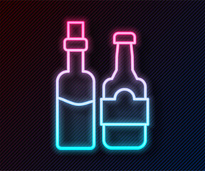 Glowing neon line Whiskey bottle icon isolated on black background. Vector