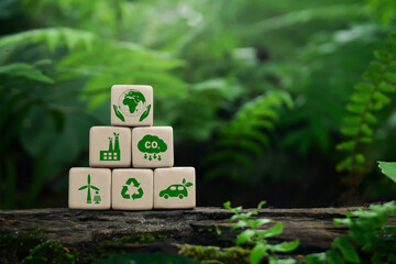 Wooden cubes with clean energy icon standing on eco friendly icon.  Green business and sustainable...