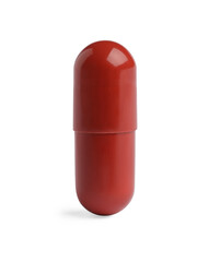 One red pill on white background. Medicinal treatment