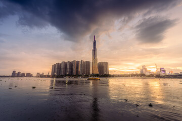 Fototapeta na wymiar Sunset view of Ho Chi Minh City skyline and Landmark 81 skyscrapers in center of heart business at Ho Chi Minh City downtown. Financial and business concept