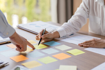 Business People brainstorming Meeting Design Ideas use post it notes to share idea professional...
