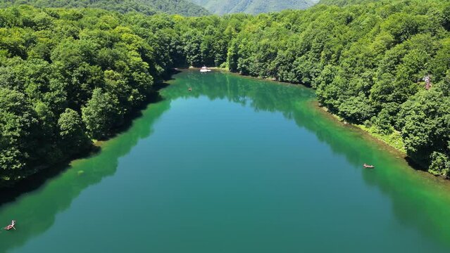The lake is surrounded by mountains and a beautiful forest. Aerial view. Belgrade lake. Bjelasica national park. Montenegro