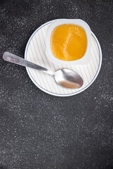 fruit puree portion apple, pear fruit no sugar meal food snack on the table copy space food background rustic top view 