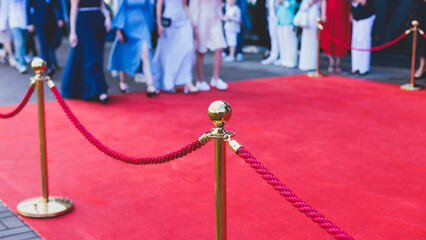 Red carpet with ropes and golden barriers on a luxury party entrance, cinema premiere film festival...