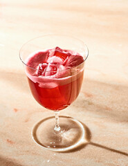 Cocktail drink  red fizzy ice  mobile sunlight