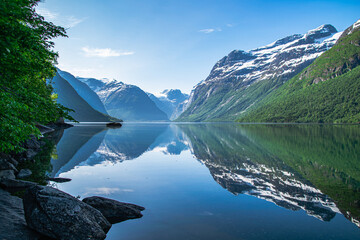 Lake Lovatnet in the mountains of Norway. Reflections in the glacier water. 