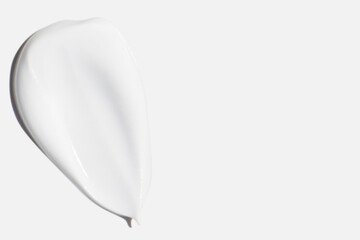 A smear of cream on a white background