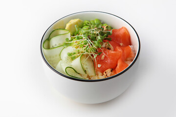 Poke with avocado, salmon and rice. Fresh cucumbers are cut into thin slices. Green beans in a bowl. Lean menu. Healthy food.He was lying flat.Space for copying. Isolated object.