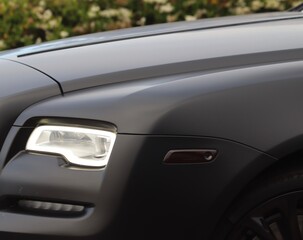 Obraz na płótnie Canvas Sleek black luxury car. Unbranded Car: Embodying Elegance and Unparalleled Style. 