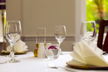 Beautiful restaurant table beside a window.