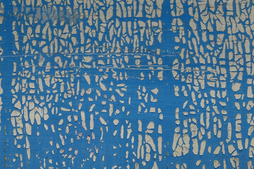 cracked and weathered plastic wrap on metal surface abstract grungy background