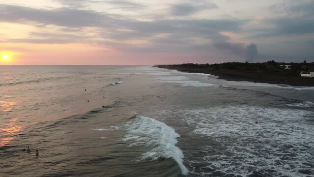 El Paredon, a charming coastal surfer village, enjoys sunlight. Rustic huts, black sands and amazing waves. A slice of tropical paradise on the shore of the Pacific Ocean in Guatemala.