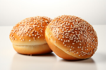 two buns with sesame seeds on white background - Powered by Adobe