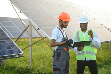 engineer and businessman planing new ecology project. around solar panel roof