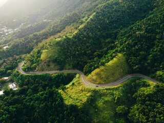 Beautiful green mountain curve road landscape of a drone capture from puerto rico