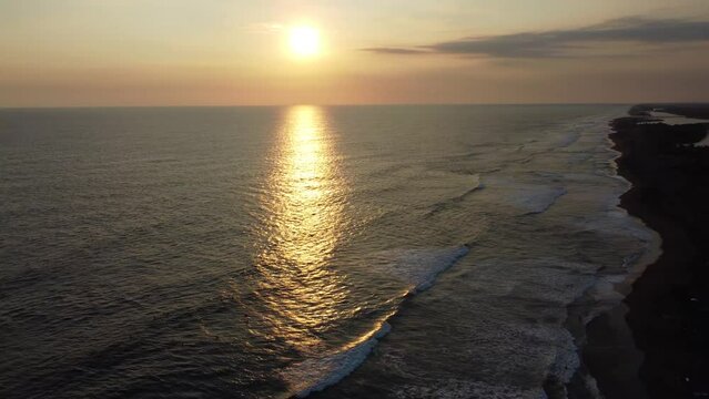 El Paredon, a charming coastal surfer village, enjoys sunlight. Rustic huts, black sands and amazing waves. A slice of tropical paradise on the shore of the Pacific Ocean in Guatemala.