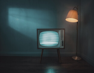 Old, retro tv in empty room at night with copy space - obrazy, fototapety, plakaty