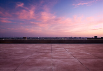 A view of the purple sky at dusk over the rooftop of a building. 
