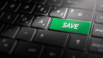Save key on laptop computer keyboard, green button on the dark grey keybord of a modern laptop notebook,  technology concept for file saving and data preservation, close-up
