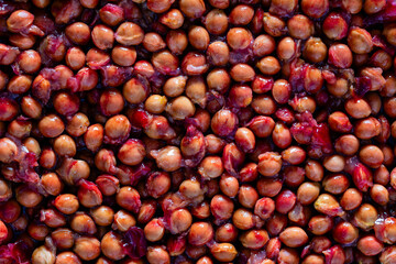 Lots of sour cherry pits as a background closeup. Texture of dried cherry kernels. Top view
