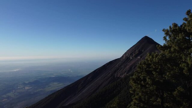 Filmed during a campout on Acatenango Volcano in 2022, "Vulcan de Fuego&acute;&acute;" erupts and smoke plumes lift up against the rising sun. Watching the raw power of the earth has something majestic.