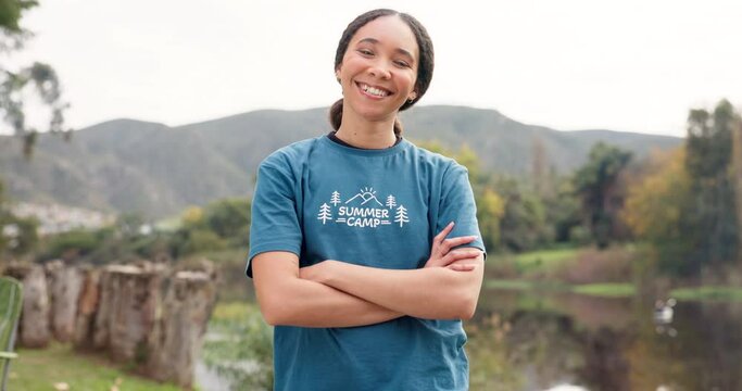 Nature, portrait of happy woman with arms crossed at summer camp and counsellor in woods with pride. Forest, lake and face of camping volunteer girl with confidence, support and leadership training.