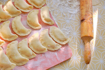 Rolling pin for rolling dough and glued dumplings.Homemade natural food.