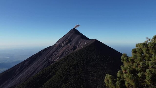 Filmed during a campout on Acatenango Volcano in 2022, "Vulcan de Fuego&acute;&acute;" erupts and smoke plumes lift up against the rising sun. Watching the raw power of the earth has something majestic.