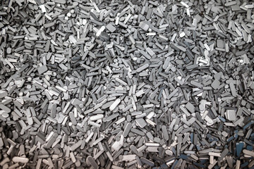 metal perforation waste, clippings round and oval shape - technological waste is waste after stamping parts from a sheet or from a strip after laser cutting