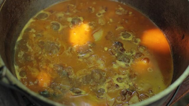 Cooking. summer vacation near the barbecue. Summer picnic, bonfire. Hot soup in a pot. Bograch in Transcarpathia, a Ukrainian dish.