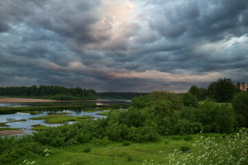 Summer landscape with thunderclouds.Background of the summer sky with thunderclouds.
